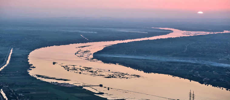 Which famous capital city is divided by the waters of the Nile River?