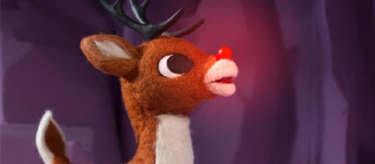 Which red-nosed reindeer guides Santa’s sleigh through foggy skies?