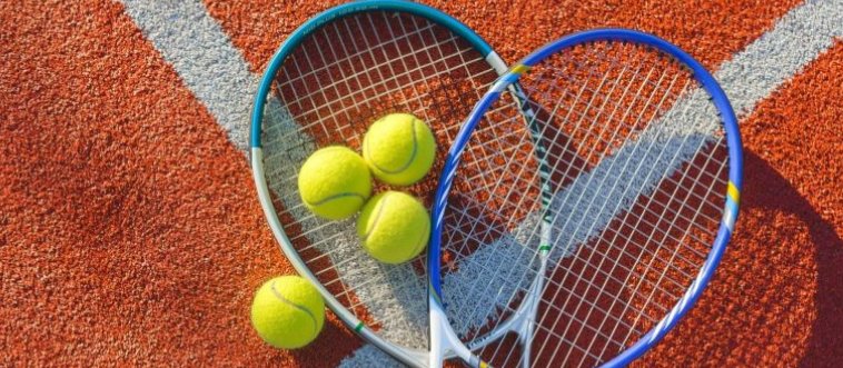 What classic court game features a bright, fuzzy yellow ball whipped back and forth over a central net?