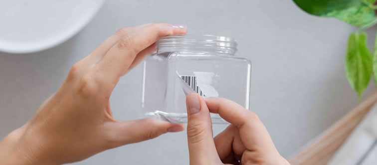 How do you remove a stubborn rental car windshield sticker without leaving residue?