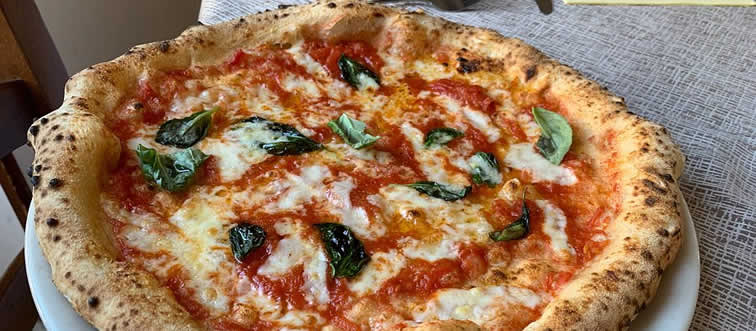 Which country is the historical home of pizza?